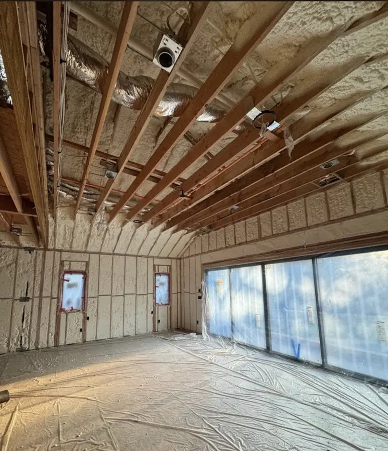 Interior walls and ceiling insulated with spray foam during new construction in Bettendorf